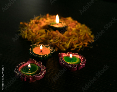 Diyas decorated with flowers for Diwali Festival