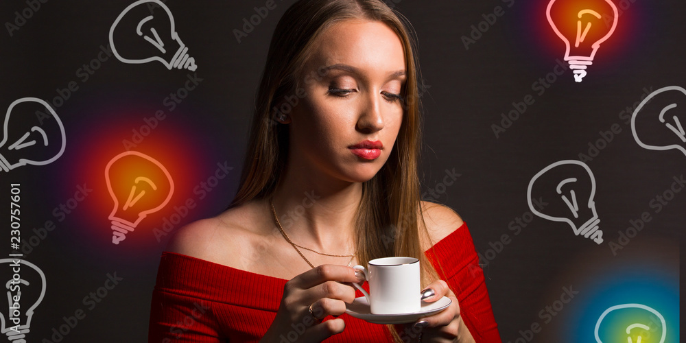 The girl drinks coffee and reflects The girl drinks coffee and reflects