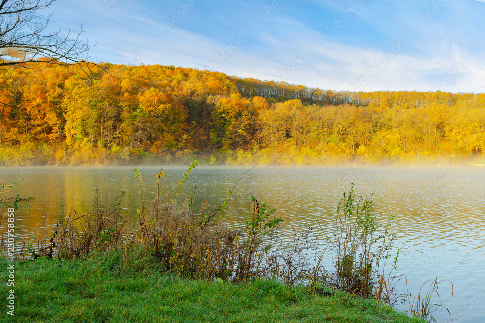 autumn morning on the shore of a mountain lake autumn morning on the shore of a mountain lake