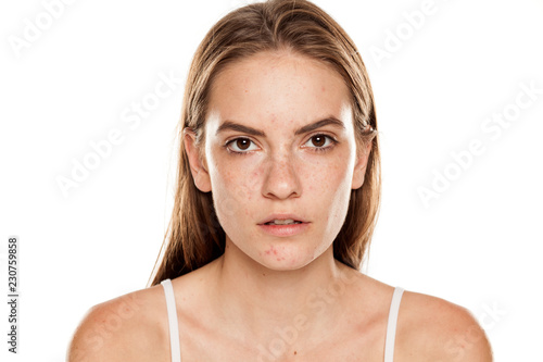 Obraz na płótnie Portrait of young beautiful woman with no makeup on white backgeound