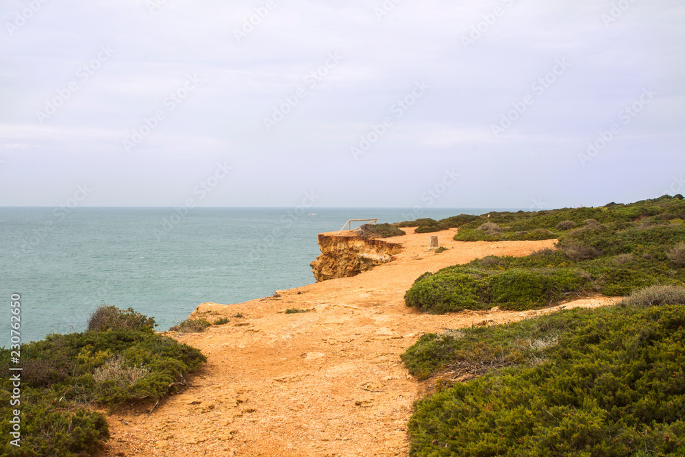 stormy cliffs on the Atlantic coast in Andalusia at high tide