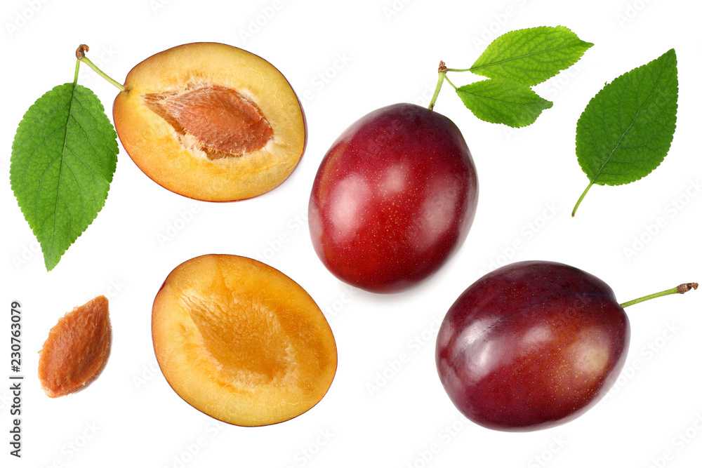 fresh plum fruit with green leaf and cut plum slices isolated on white background. top view