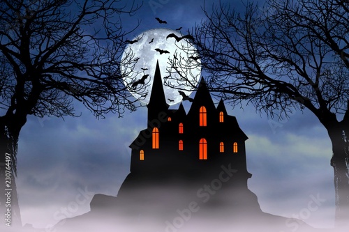 Halloween full moon night background with haunted house, scary dead trees, and bats.