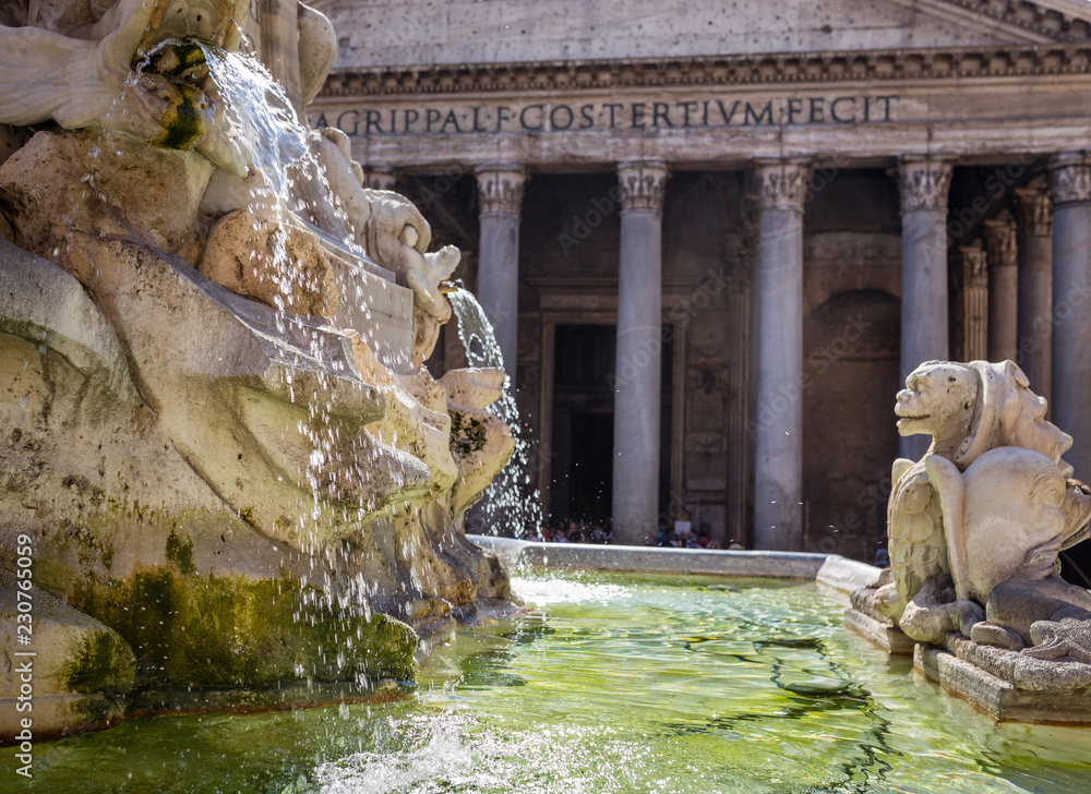 Fountain and the front of the Pantheon on a sunny day in Rome, Italy