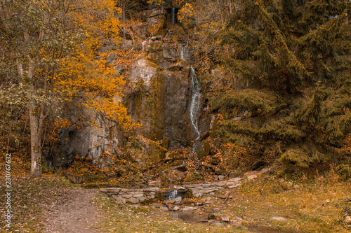 Königshütter Waterfall during autumn in Harz Mountains National Park, Germany