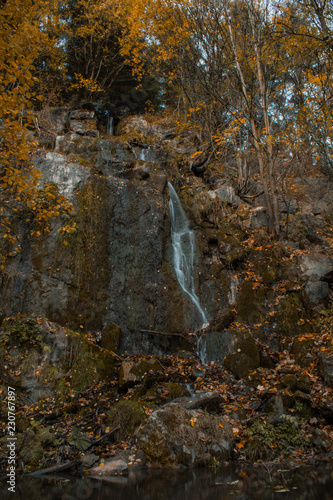 Königshütter Waterfall during autumn in Harz Mountains National Park, Germany