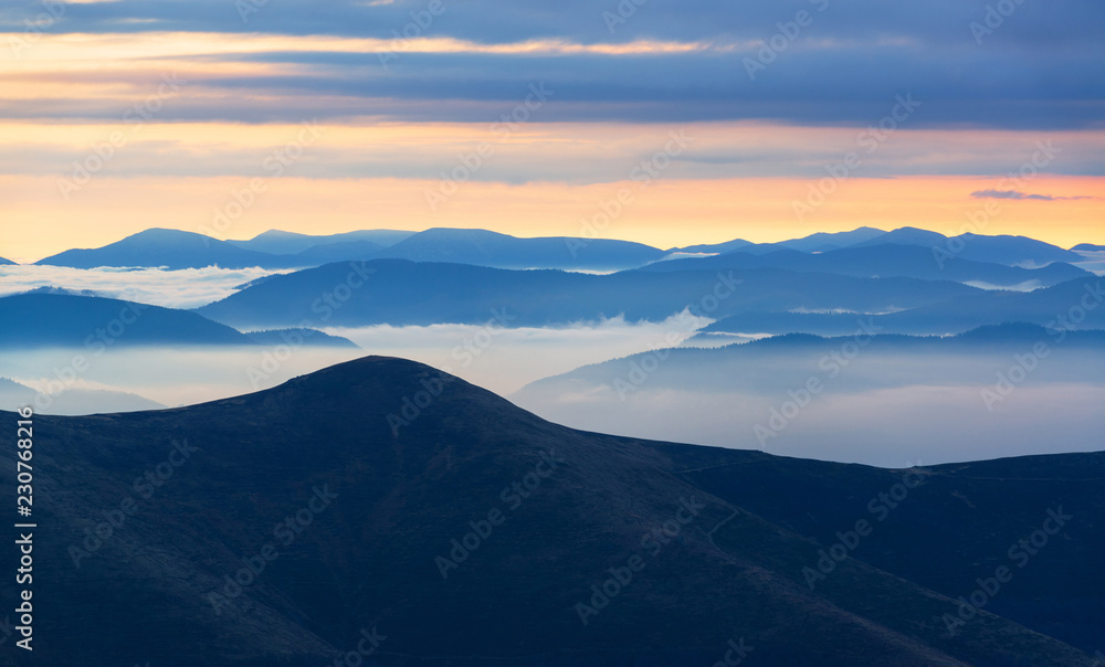 Blue mountain silhouettes in the morning