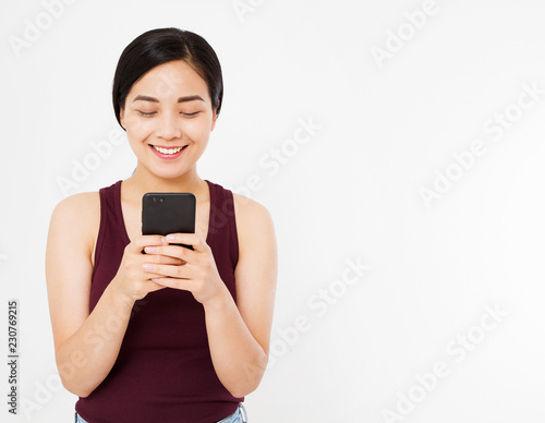 smile happy asian woman reading a pleasant message on phone isolated on white background