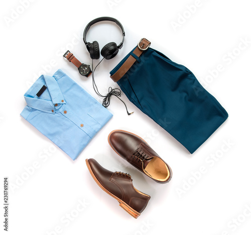 Men's casual outfits for man clothing set with brown shoes , watch, belt, trousers, shirt and earphone isolated on white background, Top view