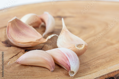 Garlics isolated  on wooden background with shadows