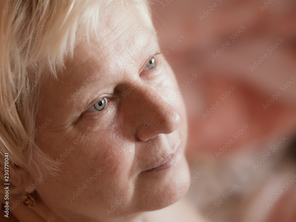 Middle aged woman portrait on light background. Middle aged woman portrait on light background.