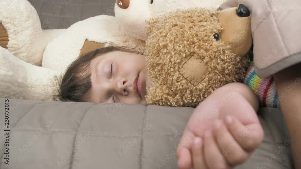 The child is sleeping. Portrait of a sleeping little girl. The child is sleeping. Portrait of a sleeping little girl.