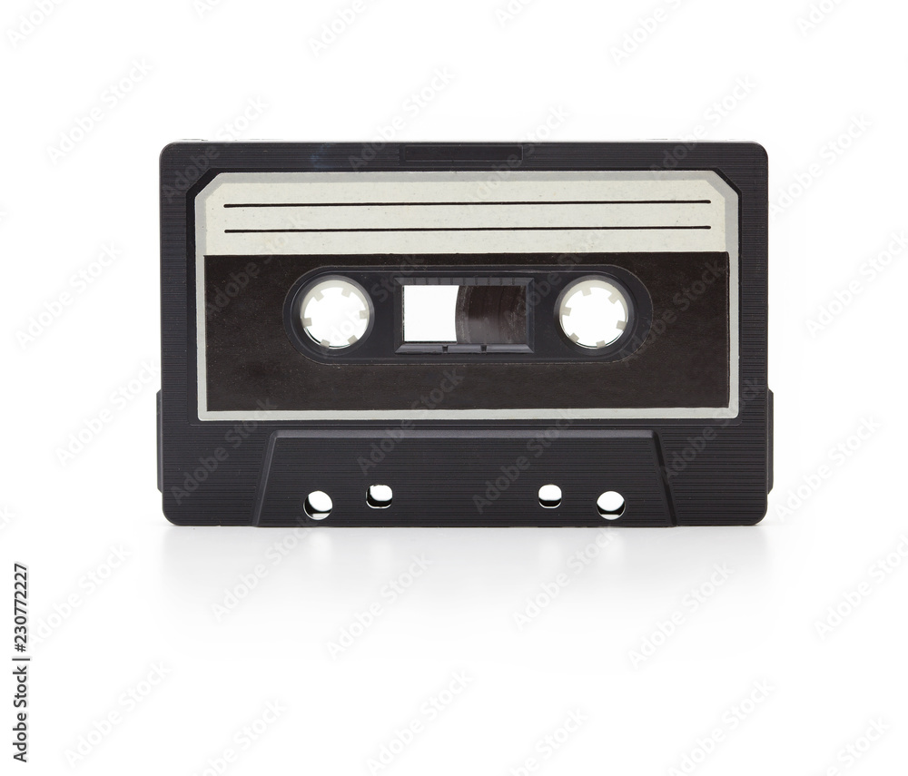 Early 70's cassette tape isolated on white with slight reflection. White blank label. (cassette is actually from the seventies, has dust and grime)
