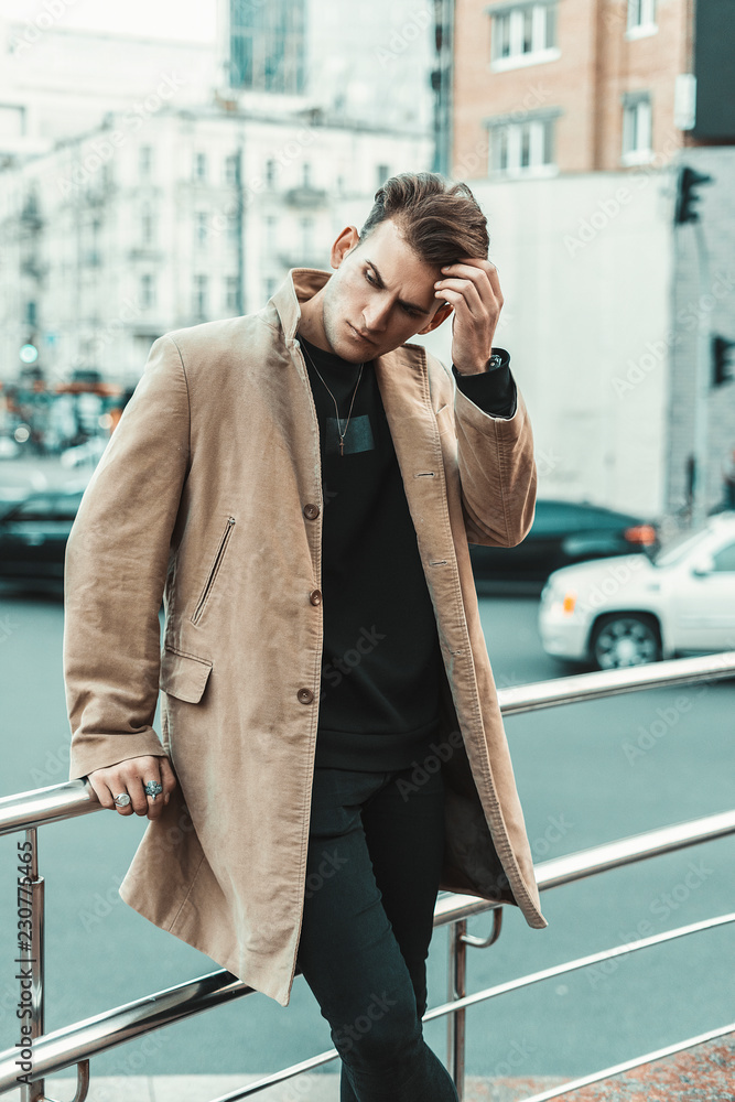 Portrait of fashionable well dressed man with beard posing