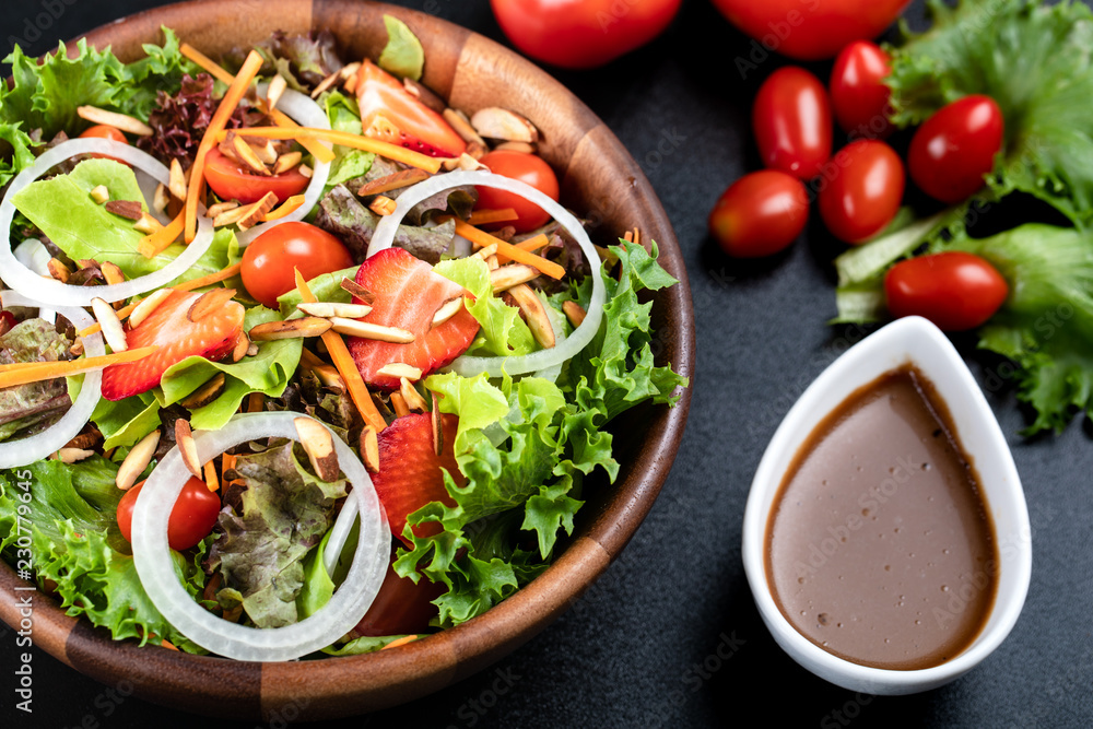 High angle of colorful vegetable salad in wood bowl High angle of colorful vegetable salad in wood bowl