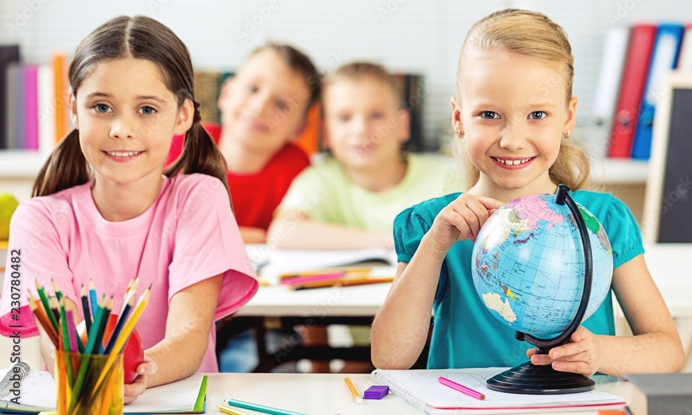 Fototapeta premium Little girl on painting lesson in school