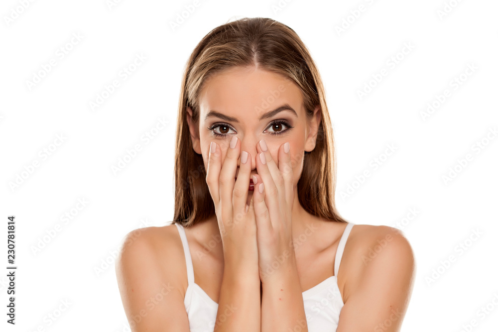 Portrait of young beautiful ashamed happy girl on white backgeound Portrait of young beautiful ashamed happy girl on white backgeound