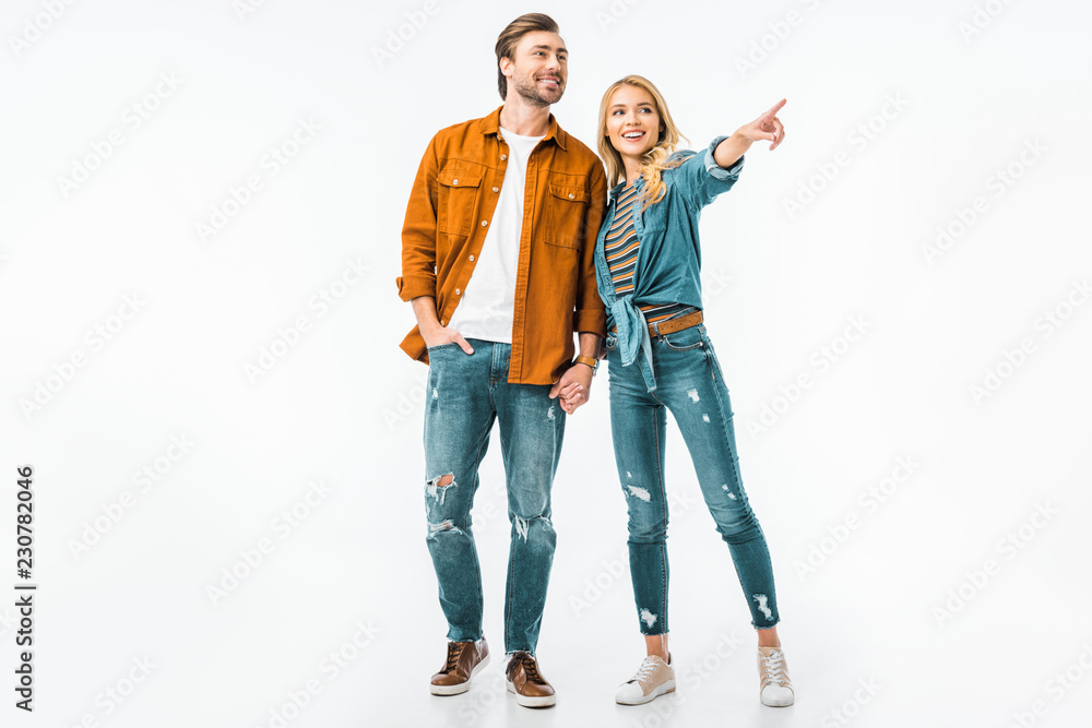 beautiful young woman pointing by finger to boyfriend isolated on white beautiful young woman pointing by finger to boyfriend isolated on white