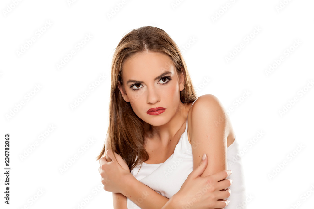 Beautiful afraid girl on white background Beautiful afraid girl on white background