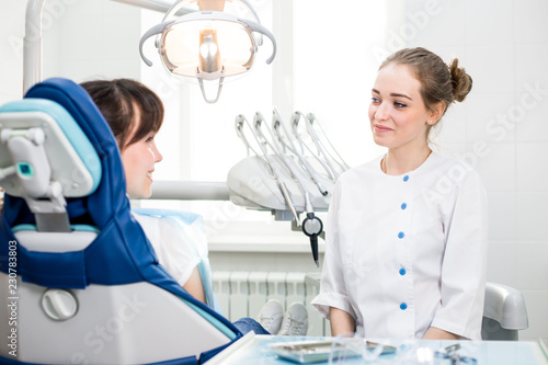 Dentist advises the patient how to care for teeth