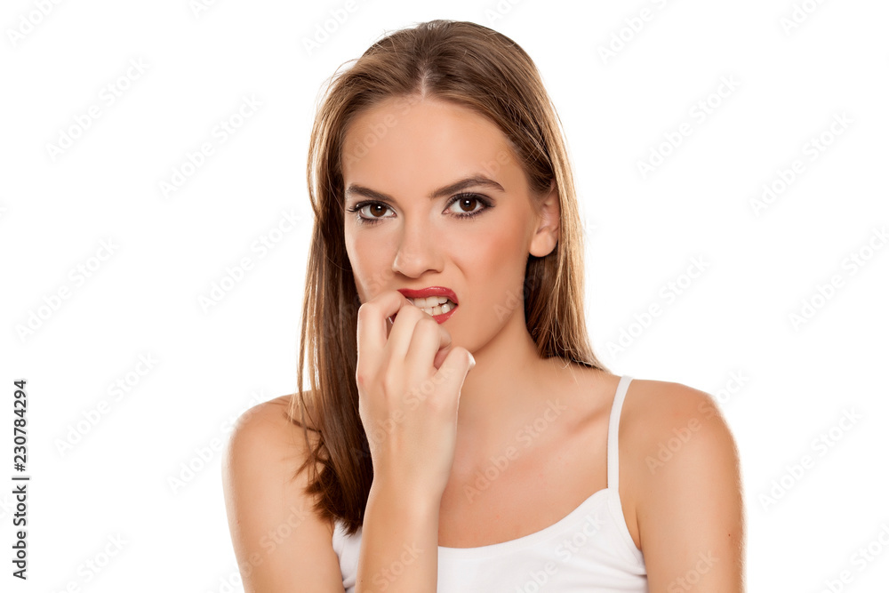 Nervous beautiful pensive girl on white background Nervous beautiful pensive girl on white background