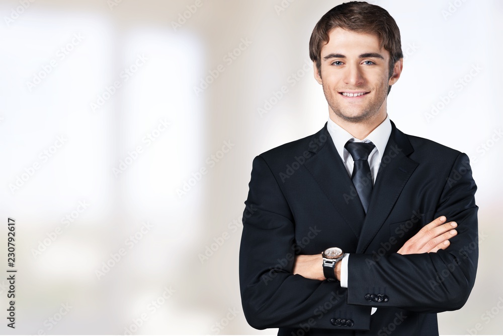 Senior business man in grey suit on light background - obrazy, fototapety, plakaty 