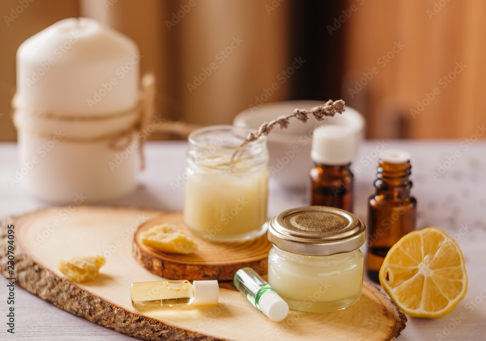 Hand cream and lip balm in a glass jar. Natural organic cosmetics with honey, wax and oils. Hand cream and lip balm in a glass jar. Natural organic cosmetics with honey, wax and oils.