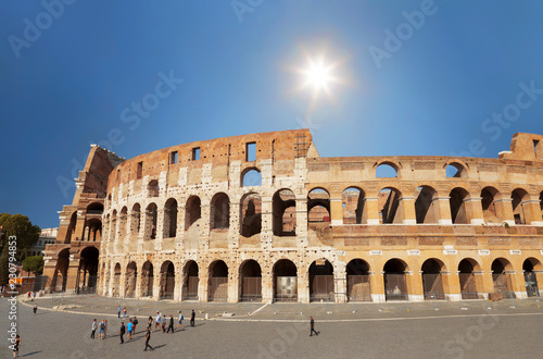Tourists at the walls of the Colosseum in Rome, Italy © vesta48