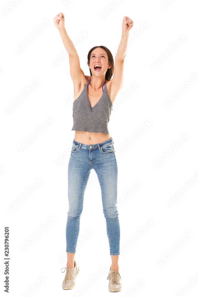 Full body cheerful young asian woman with hands in air against isolated white background Full body cheerful young asian woman with hands in air against isolated white background