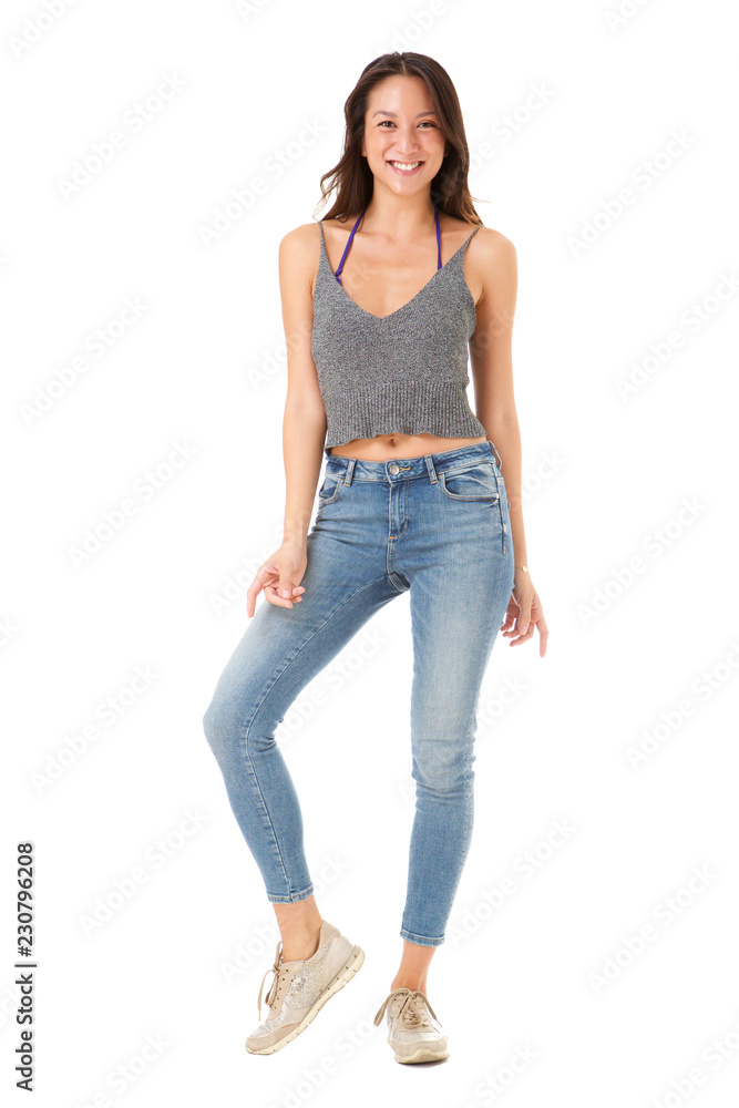 Full body happy young asian woman posing against isolated white background Full body happy young asian woman posing against isolated white background