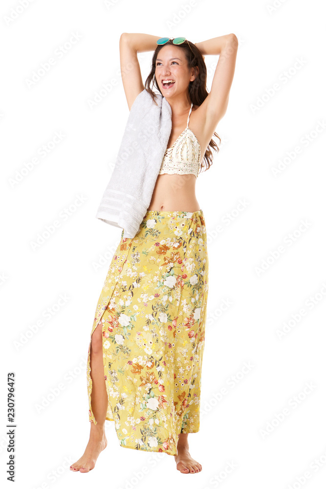 Full body cheerful young asian woman laughing with hands behind head against white isolated background Full body cheerful young asian woman laughing with hands behind head against white isolated background