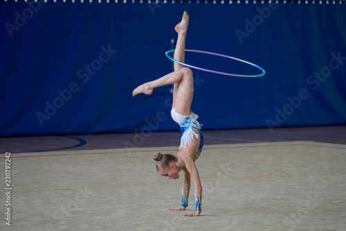 gymnast performs with a sports subject in competition