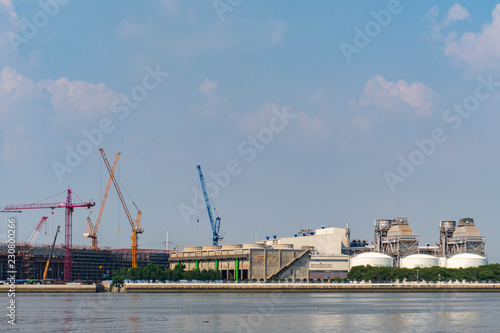 Large construction By the river with crane work.