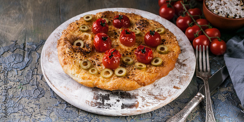 Delicious pizza four cheese with cherry tomatoes