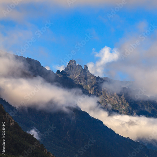 Clouds over the rocky ridge of the mountainous region of the North Caucasus in Russia. © olgapkurguzova