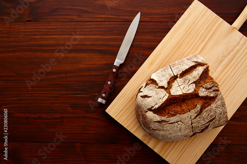 Rye bread on dark wooden table