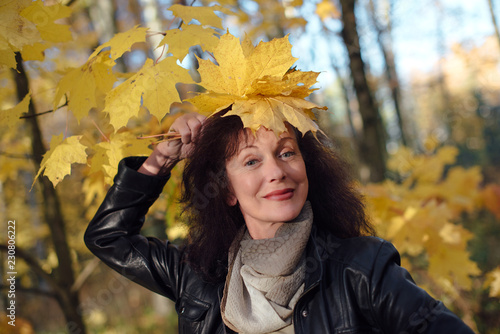 Wallpaper Mural beautiful woman 50 years in autumn forest Torontodigital.ca