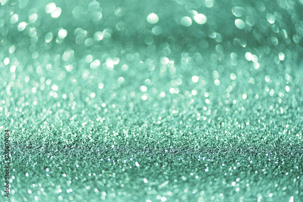 Blue and silver abstract bokeh lights. Shiny glitter background with copy space. New year and Christmas concept. Sparkling greeting card Blue and silver abstract bokeh lights. Shiny glitter background with copy space. New year and Christmas concept. Sparkling greeting card