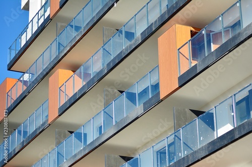 Modern apartment buildings on a sunny day with a blue sky. Facade of a modern apartment building