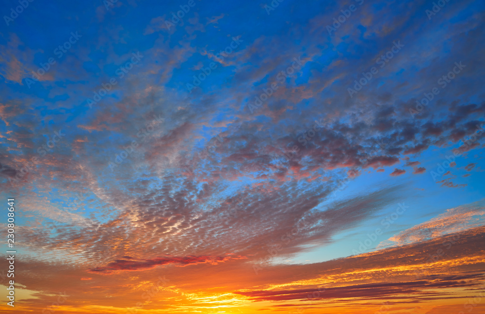 Sunset sky with orange clouds over blue Sunset sky with orange clouds over blue