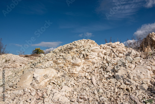 Quarry zeolite raw mineral and stone wall.