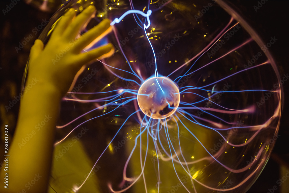 Close up of Plasma globe and child's hand