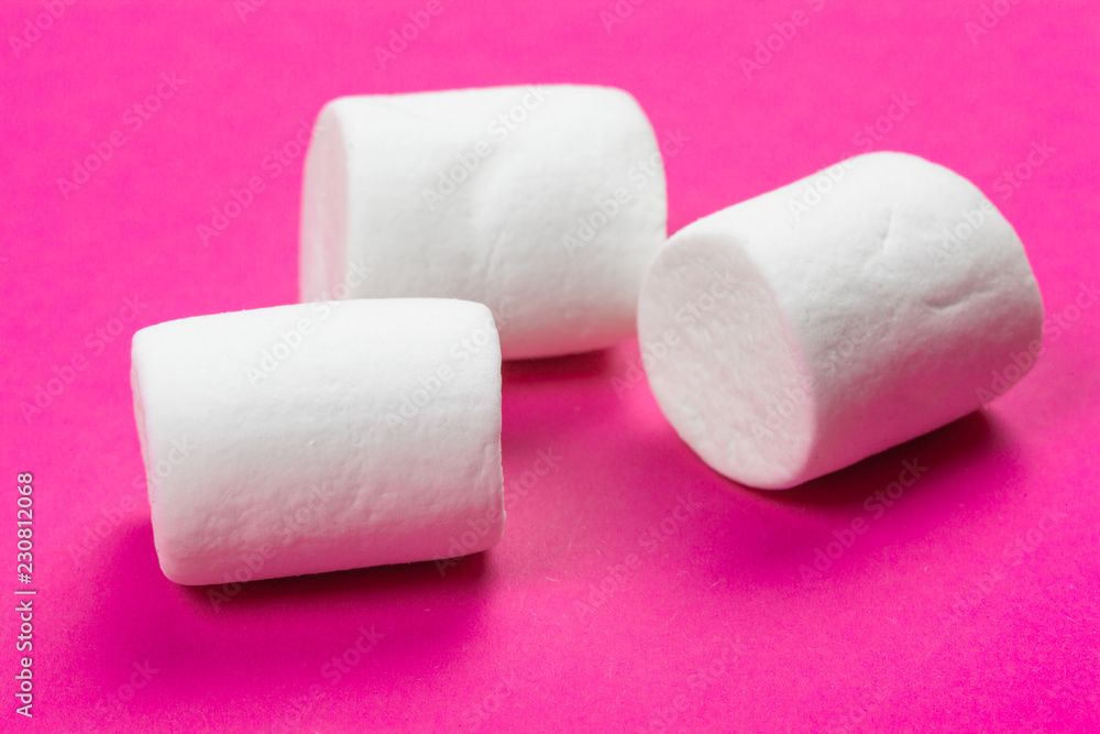 marshmallows on a pink background. top view marshmallows on a pink background. top view