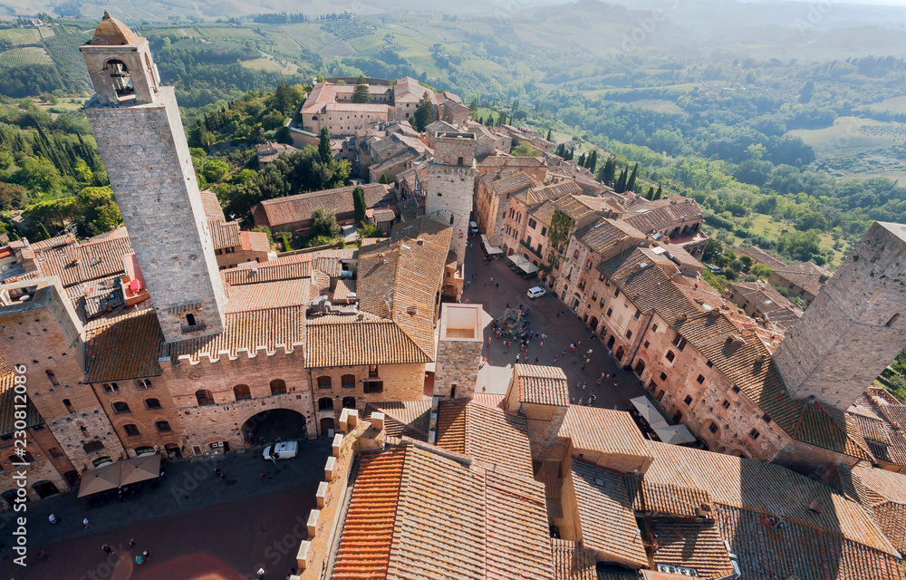 Historical houses and natural landscape of italian town San Gimignano. UNESCO World Heritage Site