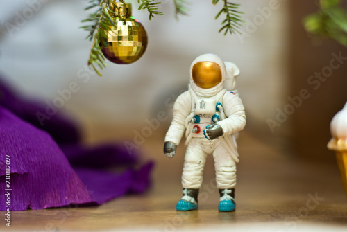 Astronaut under the tree. Disco ball. Toy minifigures. © Сергей Чиликин