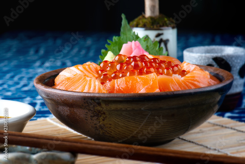 Salmon sashimi and salmon roe with rice.