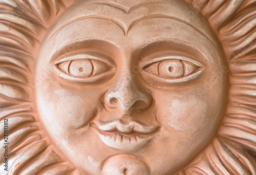 Terracotta sun face