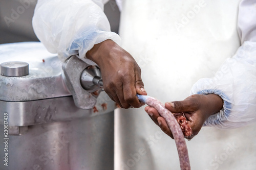 Sausage being made in butchery.