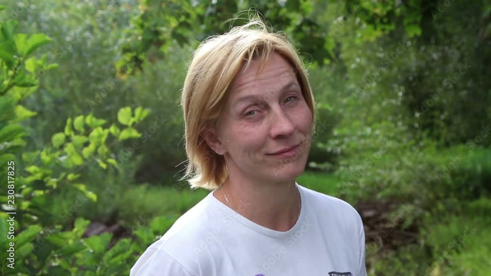 Beautiful woman in the summer park.
Beautiful woman in the summer park.