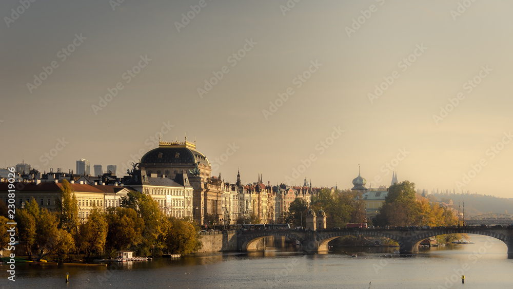PRAGUE, CZECH REPUBLIC - 26 october 2018: View over the water and the building during a nice sunset in the city